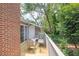 Outdoor wooden deck with nature views surrounded by mature trees and lush landscaping at 1750 Clairmont Rd # 32, Decatur, GA 30033