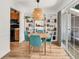 Dining area with hardwood floors, stylish light fixture, and open shelving for a modern touch at 1750 Clairmont Rd # 32, Decatur, GA 30033