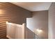 Interior staircase featuring a light fixture and white railings, showcasing a modern design at 1750 Clairmont Rd # 32, Decatur, GA 30033