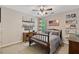 Bedroom featuring a bed, shelving, and a desk at 305 Jasmine Ct, Woodstock, GA 30189