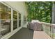 Relaxing outdoor view from the deck, with a grill for outdoor cooking at 305 Jasmine Ct, Woodstock, GA 30189
