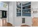 Entryway with white painted built-in shelves at 305 Jasmine Ct, Woodstock, GA 30189