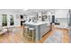 Spacious eat-in kitchen with custom cabinets, island and stainless appliances at 305 Jasmine Ct, Woodstock, GA 30189