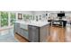 Eat-in kitchen island featuring a farmhouse sink, stainless dishwasher and seating at 305 Jasmine Ct, Woodstock, GA 30189