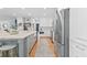 Bright and spacious kitchen featuring custom cabinets, island and stainless appliances at 305 Jasmine Ct, Woodstock, GA 30189