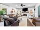 Bright living room with a cozy fireplace and comfortable seating arrangement at 305 Jasmine Ct, Woodstock, GA 30189