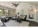 Cozy screened porch with ample seating, ceiling fan and wooded views at 305 Jasmine Ct, Woodstock, GA 30189