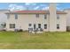 Expansive backyard featuring a patio, barbecue, and green lawn, perfect for outdoor gatherings at 6637 Chason Woods Ct, Jonesboro, GA 30238
