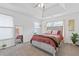Bedroom showcasing natural light, minimalist décor, and inviting bedding for a serene sleeping space at 6637 Chason Woods Ct, Jonesboro, GA 30238