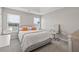 Bright bedroom with large windows, a comfortable bed, and a functional workspace at 6637 Chason Woods Ct, Jonesboro, GA 30238