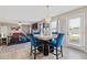 Cozy dining area featuring modern chandelier and open view of living room and backyard at 6637 Chason Woods Ct, Jonesboro, GA 30238