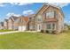Attractive brick and stone two-story home with a lush lawn, attached two-car garage, and inviting curb appeal at 6637 Chason Woods Ct, Jonesboro, GA 30238