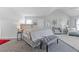 Spacious bedroom featuring a comfortable bed, accent furniture, and a serene color scheme at 6637 Chason Woods Ct, Jonesboro, GA 30238