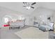 Spacious main bedroom with high ceiling, ceiling fan and comfortable bed with accent furnishings at 6637 Chason Woods Ct, Jonesboro, GA 30238