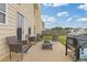 Outdoor patio featuring comfortable seating and a grill, ideal for entertaining and relaxation at 6637 Chason Woods Ct, Jonesboro, GA 30238