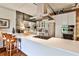 Contemporary kitchen with quartz countertops, stainless steel appliances and breakfast bar at 130 26Th St # 402, Atlanta, GA 30309
