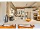 Bright kitchen with stainless steel appliances, white cabinetry, and exposed brick and concrete walls at 130 26Th St # 402, Atlanta, GA 30309
