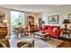 Bright living room boasts large windows, hardwood floors, and elegant furniture at 130 26Th St # 402, Atlanta, GA 30309
