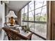 Bright sunroom featuring floor-to-ceiling windows, wicker furniture, and ample natural light, a cozy indoor-outdoor space at 130 26Th St # 402, Atlanta, GA 30309