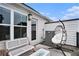 Tranquil back deck with a stylish hanging chair, lounge seating, and views of the surrounding greenery at 2505 Astaire Nw Ct, Atlanta, GA 30318