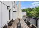 Outdoor view of a furnished back deck area featuring a grill, table, and shade umbrella at 2505 Astaire Nw Ct, Atlanta, GA 30318