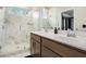 Elegant bathroom featuring a double vanity, marble shower, and plenty of natural light at 2505 Astaire Nw Ct, Atlanta, GA 30318