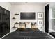 Bedroom featuring black and gold bedding, stylish décor, and windows with natural light at 2505 Astaire Nw Ct, Atlanta, GA 30318
