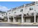 View of townhome exteriors with private back decks, offering outdoor living and attached garages at 2505 Astaire Nw Ct, Atlanta, GA 30318