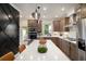 Modern kitchen with stainless steel appliances, a quartz countertop island, and warm lighting at 2505 Astaire Nw Ct, Atlanta, GA 30318