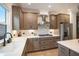 Well-equipped kitchen featuring modern appliances, stone countertops, and custom cabinetry at 2505 Astaire Nw Ct, Atlanta, GA 30318