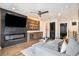 Open living room with an entertainment center, modern fireplace, and wet bar at 2505 Astaire Nw Ct, Atlanta, GA 30318