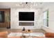 Stylish living room featuring a fireplace, marble accent wall, and hardwood floors at 2505 Astaire Nw Ct, Atlanta, GA 30318