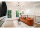 Bright living room showcasing hardwood floors, modern lighting, and comfortable furnishings at 2505 Astaire Nw Ct, Atlanta, GA 30318