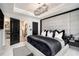 Spacious main bedroom with a custom walk-in closet, stylish decor, and plush carpeting at 2505 Astaire Nw Ct, Atlanta, GA 30318
