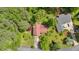 Aerial view of a charming home with lush green surroundings and mature trees on an oversized lot at 316 Shiloh Hills Nw Dr, Kennesaw, GA 30144