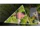 Aerial view of a well-maintained house with lush landscaping, surrounded by mature trees and a driveway at 316 Shiloh Hills Nw Dr, Kennesaw, GA 30144