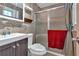 Bathroom features a vanity, toilet, and a shower with sliding glass doors and tiled walls at 316 Shiloh Hills Nw Dr, Kennesaw, GA 30144