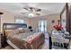 Bedroom with neutral walls, carpet and natural light from two windows with patterned curtains at 316 Shiloh Hills Nw Dr, Kennesaw, GA 30144