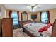 Bedroom with neutral walls, carpet and natural light from two windows with patterned curtains at 316 Shiloh Hills Nw Dr, Kennesaw, GA 30144