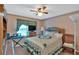 Well-lit bedroom features soft carpet, neutral walls, and a charming window with patterned curtains at 316 Shiloh Hills Nw Dr, Kennesaw, GA 30144