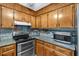 Well-equipped kitchen with granite countertops, modern appliances, and ample cabinet space at 316 Shiloh Hills Nw Dr, Kennesaw, GA 30144