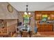 Cozy eat-in kitchen with a breakfast table, wood cabinets, and a window overlooking the backyard at 316 Shiloh Hills Nw Dr, Kennesaw, GA 30144