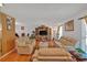 Bright living room featuring neutral-toned sofas, a cozy rug, and a decorative entertainment center at 316 Shiloh Hills Nw Dr, Kennesaw, GA 30144