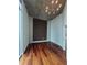 Spacious bedroom with a modern ceiling fixture and hardwood floors at 3324 Peachtree Ne Rd # 3001, Atlanta, GA 30326