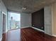 Bright bedroom with hardwood floors and expansive windows offering city views at 3324 Peachtree Ne Rd # 3001, Atlanta, GA 30326