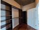 Spacious walk-in closet with custom shelving and hardwood floors for organized storage at 3324 Peachtree Ne Rd # 3001, Atlanta, GA 30326