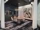Elegant conference room featuring a round table, sleek lighting, and modern decor for collaborative meetings at 3324 Peachtree Ne Rd # 3001, Atlanta, GA 30326