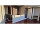 Home's entryway featuring hardwood floors, modern staircase, and dark wood accents at 3324 Peachtree Ne Rd # 3001, Atlanta, GA 30326