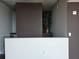 View of the home's entrance featuring a decorative plant and concrete ceilings for an industrial look at 3324 Peachtree Ne Rd # 3001, Atlanta, GA 30326