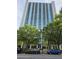 Striking view of a tall condo building surrounded by lush greenery, showcasing city living at 3324 Peachtree Ne Rd # 3001, Atlanta, GA 30326